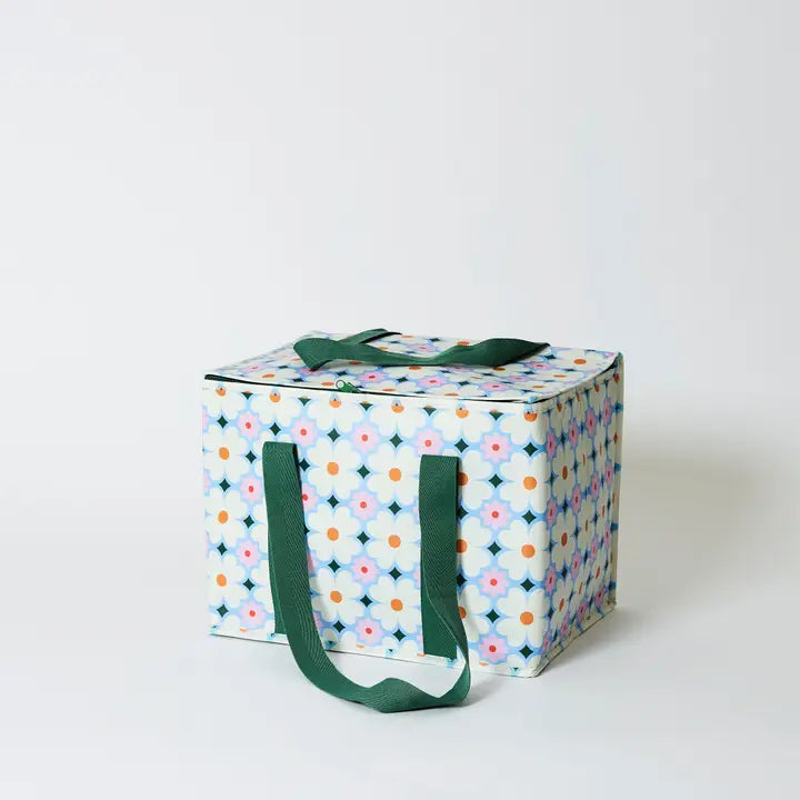 Storage box with floral pattern and green handles on a white background