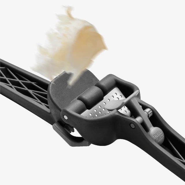 Close-up of a black ski brush with bristles on a white background