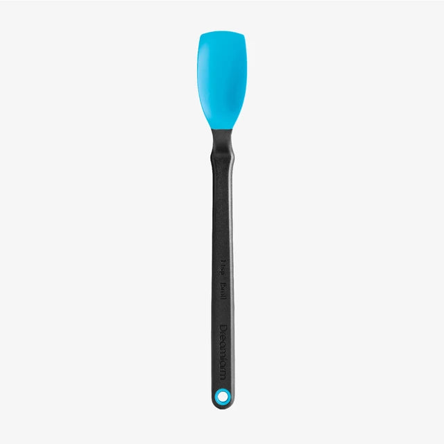 Silicone spatula with blue head and black handle on a white background