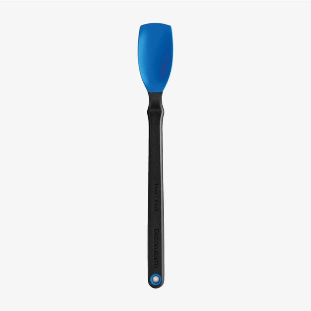 Silicone spatula with blue head and black handle on a white background