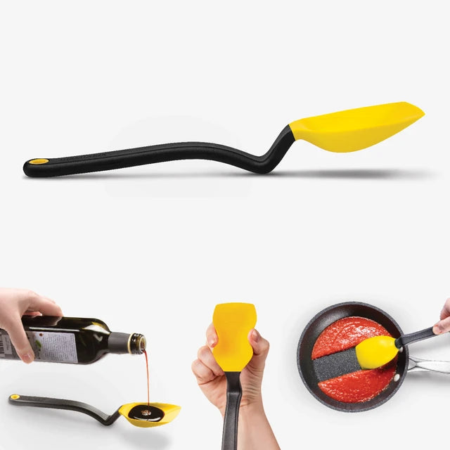 Yellow and black spoon being used to pour oil into a pan on a white background