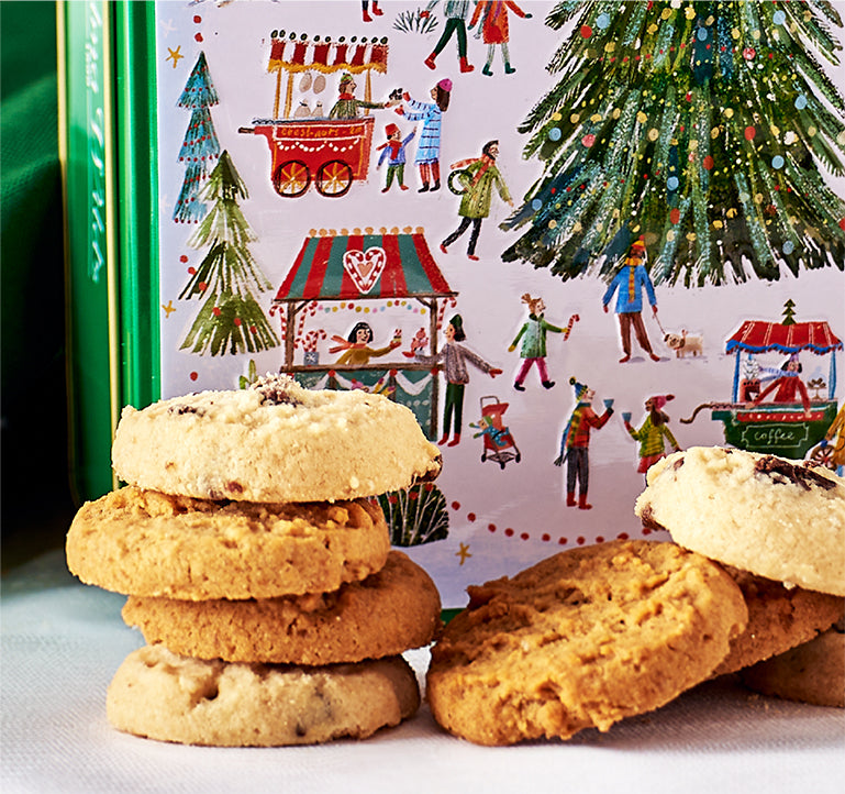 An embossed Christmas tin with biscuits