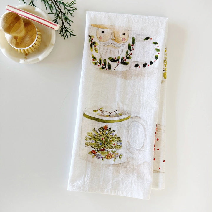 Decorative towel with Christmas-themed designs on a white surface