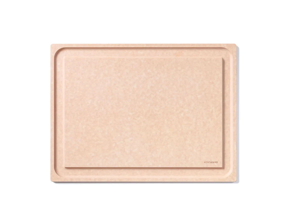 Beige compressed wood cutting board with a subtle pattern on a white background