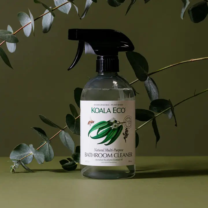 Koala Eco bathroom cleaner bottle with eucalyptus leaves on a green background