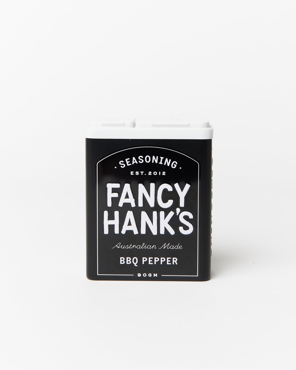 Fancy Hanks BBQ pepper seasoning in black and white tin on a white background