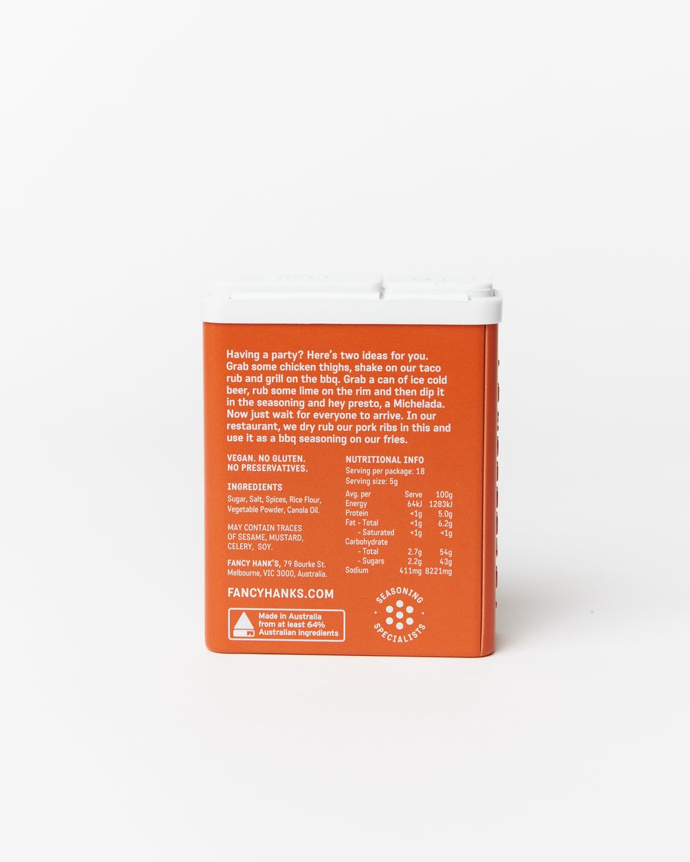 Fancy Hanks taco rub seasoning in an orange tin with white writing on a white background