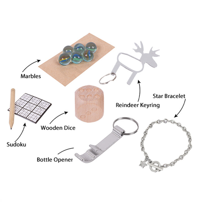Collection of items including marbles, wooden dice, Sudoku board, bottle opener, reindeer keyring, and star bracelet on a white background.
