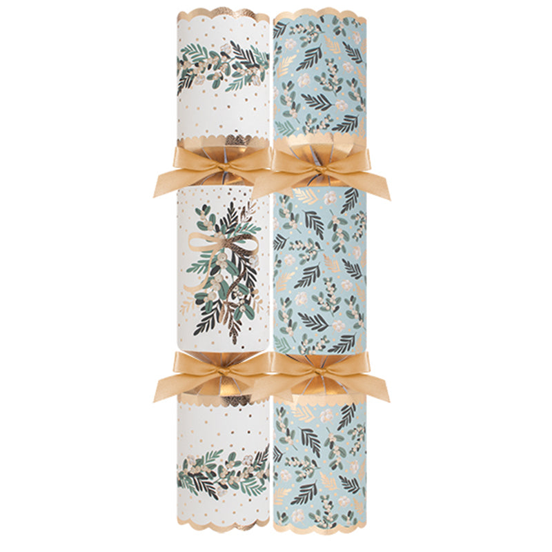 Christmas crackers with gold ribbon on white background