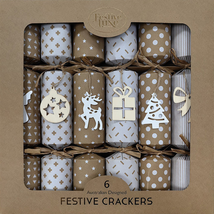 Set of festive crackers with decorative patterns and wooden cutouts in a brown box packaging.