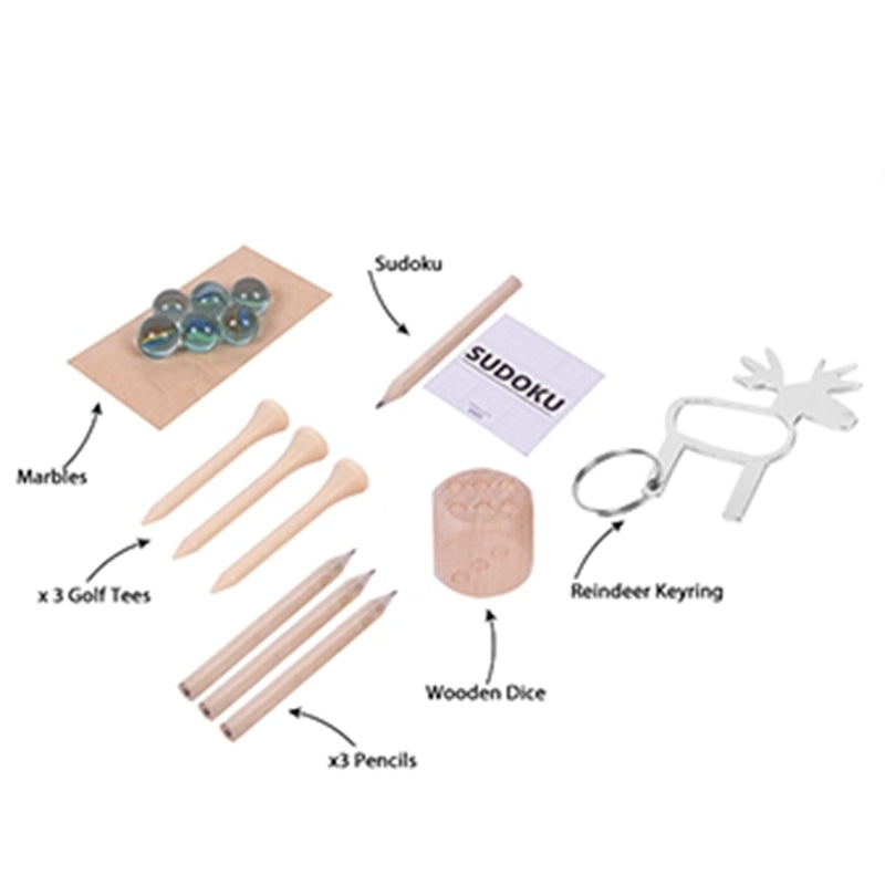Collection of items including marbles, golf tees, pencils, a Sudoku set, wooden dice, and a reindeer keyring on a white background.