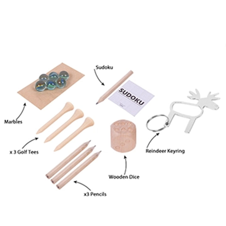 Collection of items including marbles, golf tees, pencils, a Sudoku set, wooden dice, and a reindeer keyring on a white background.
