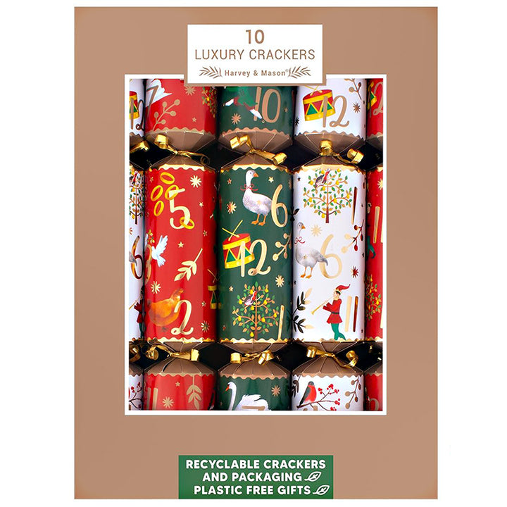 Box of 10 luxury crackers with festive designs on a brown background