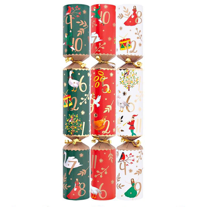 Three Christmas crackers with festive designs on a white background