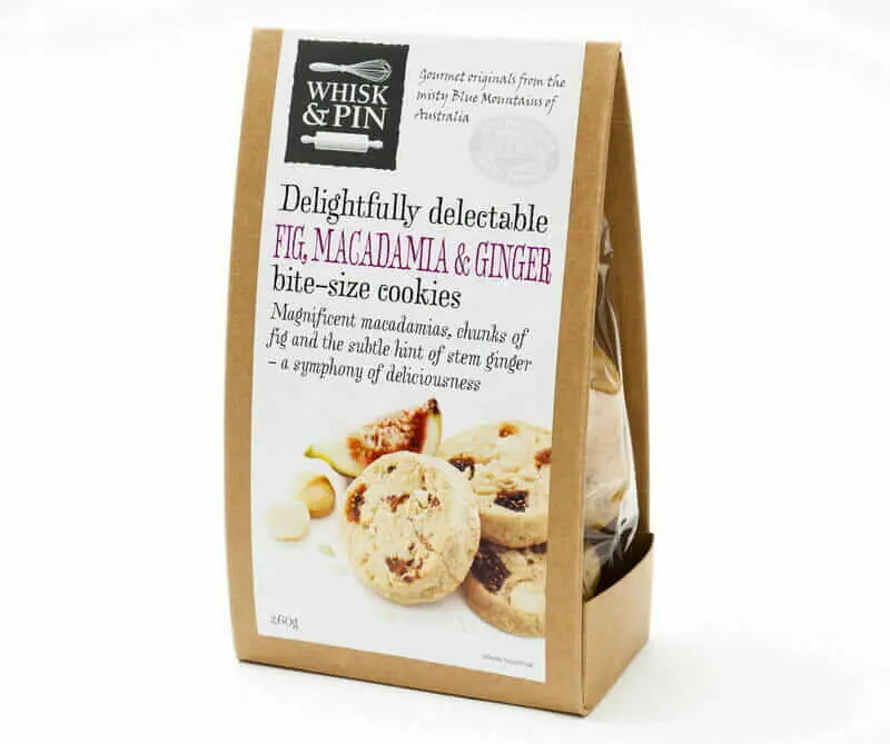 Packaging of Whisk & Pin fig, macadamia, and ginger cookies on a white background