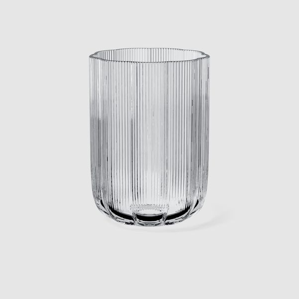 Clear glass vase with ribbed texture on a white background