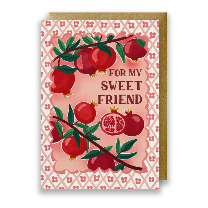 Greeting card with pomegranate design and 'For my sweet friend' text on a patterned background.
