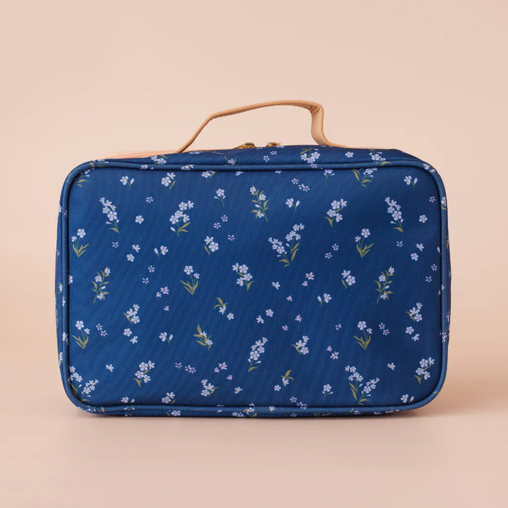 Blue floral-patterned lunch bag on a beige background