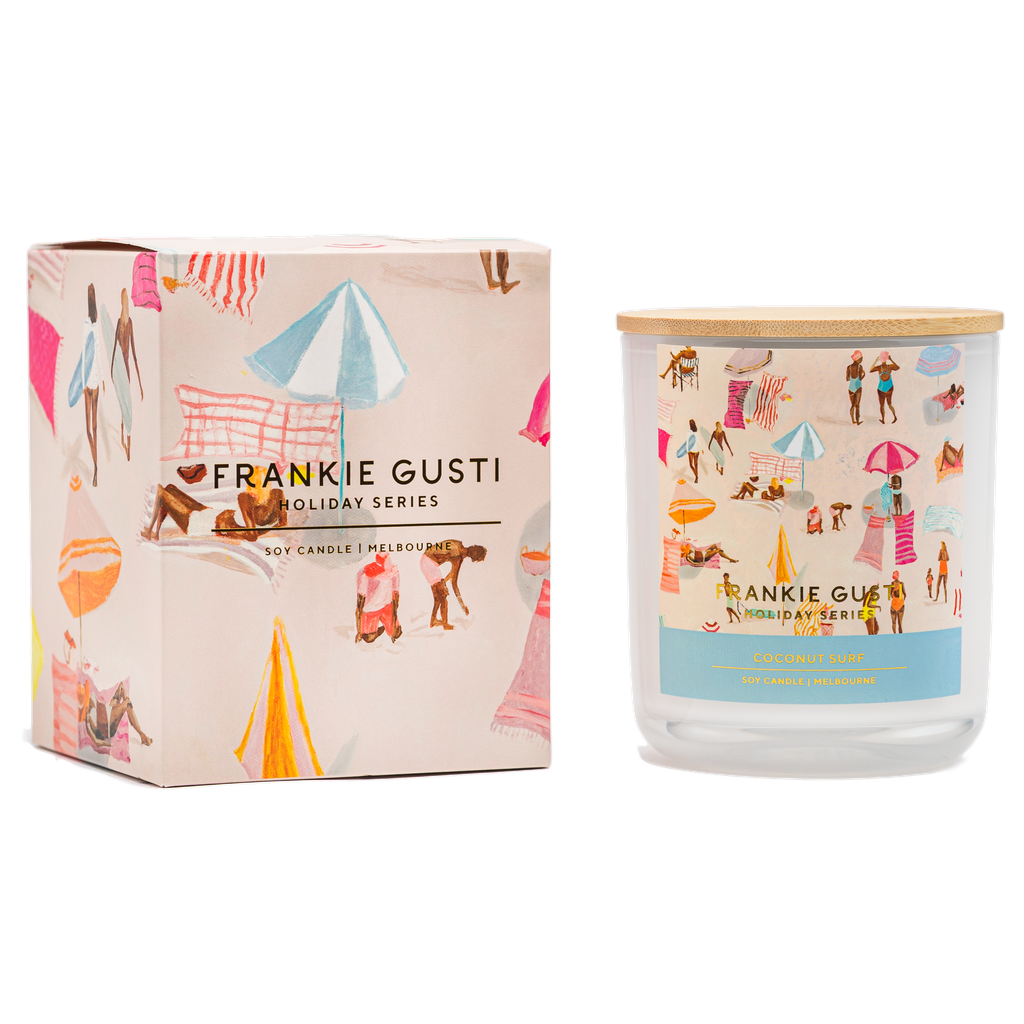 Frankie Gusti holiday series candle and packaging on a white background