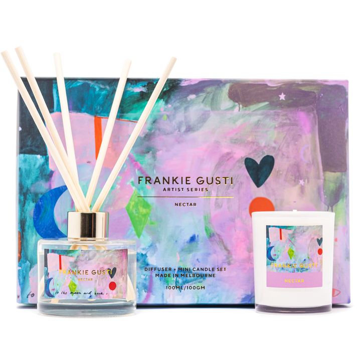 Diffuser and mini candle set by Frankie Gusti with colorful packaging on a white background