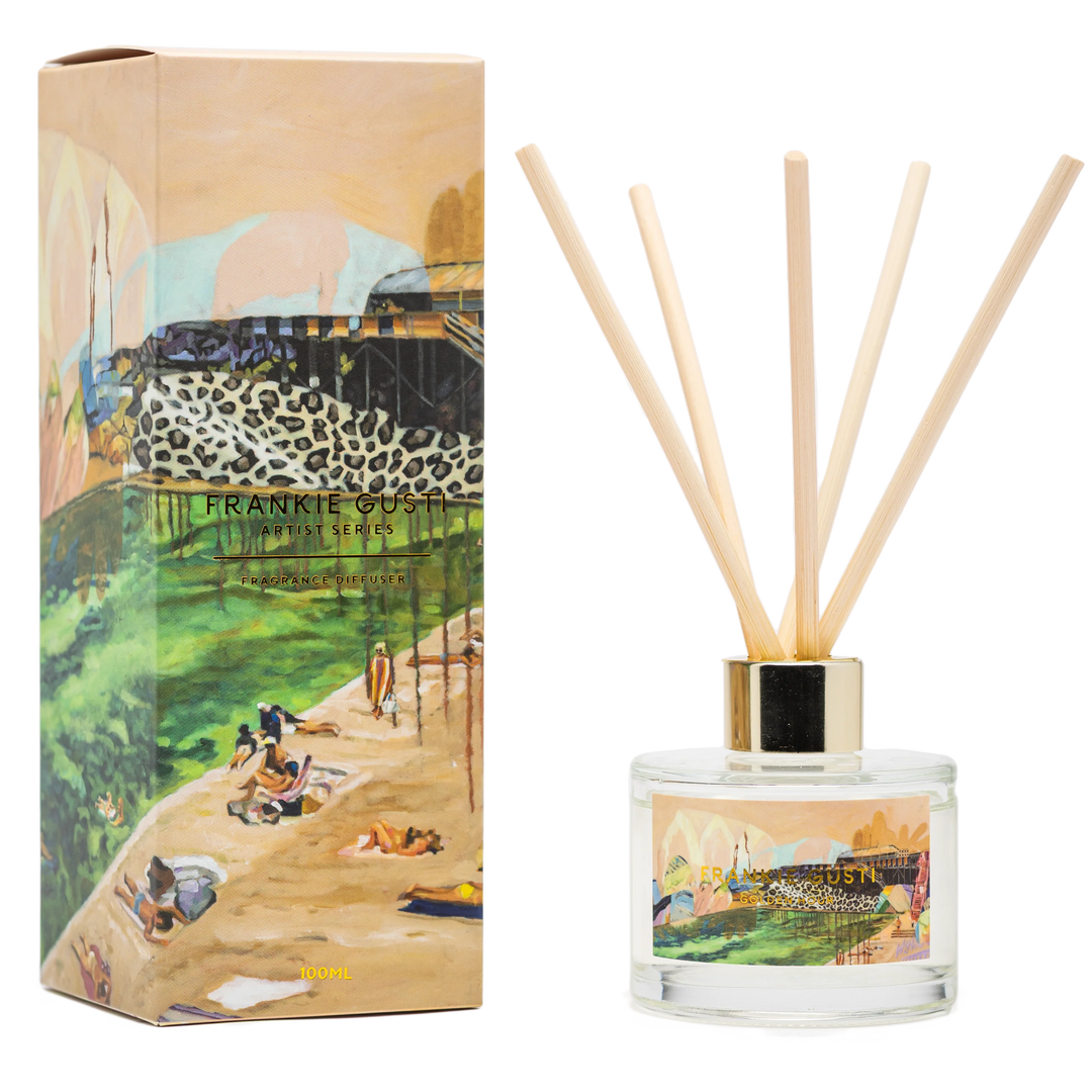 Reed diffuser set with artistic packaging featuring a scenic design.