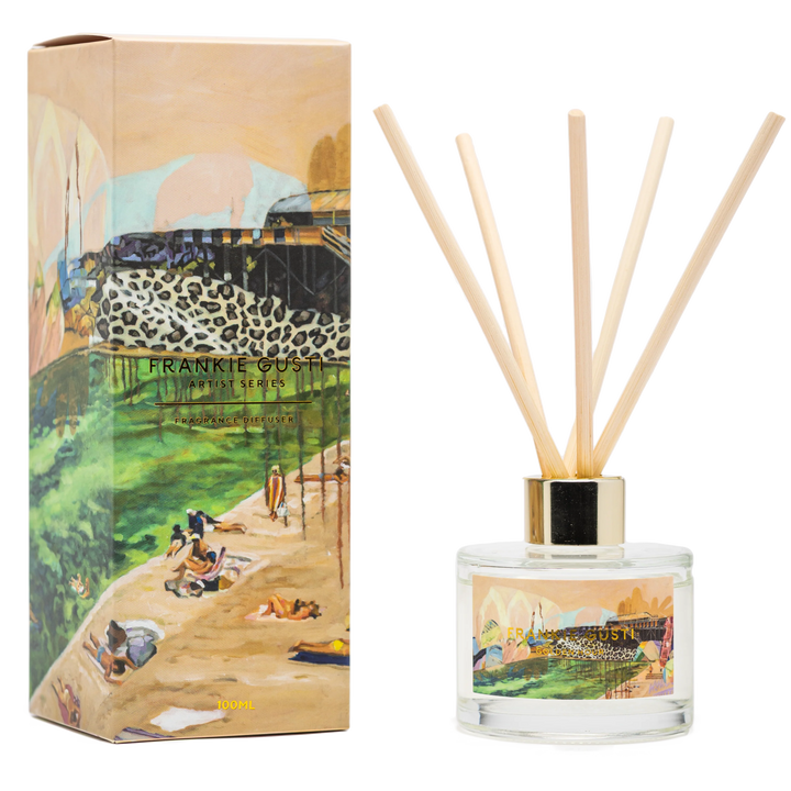 Reed diffuser set with artistic packaging featuring a scenic design.