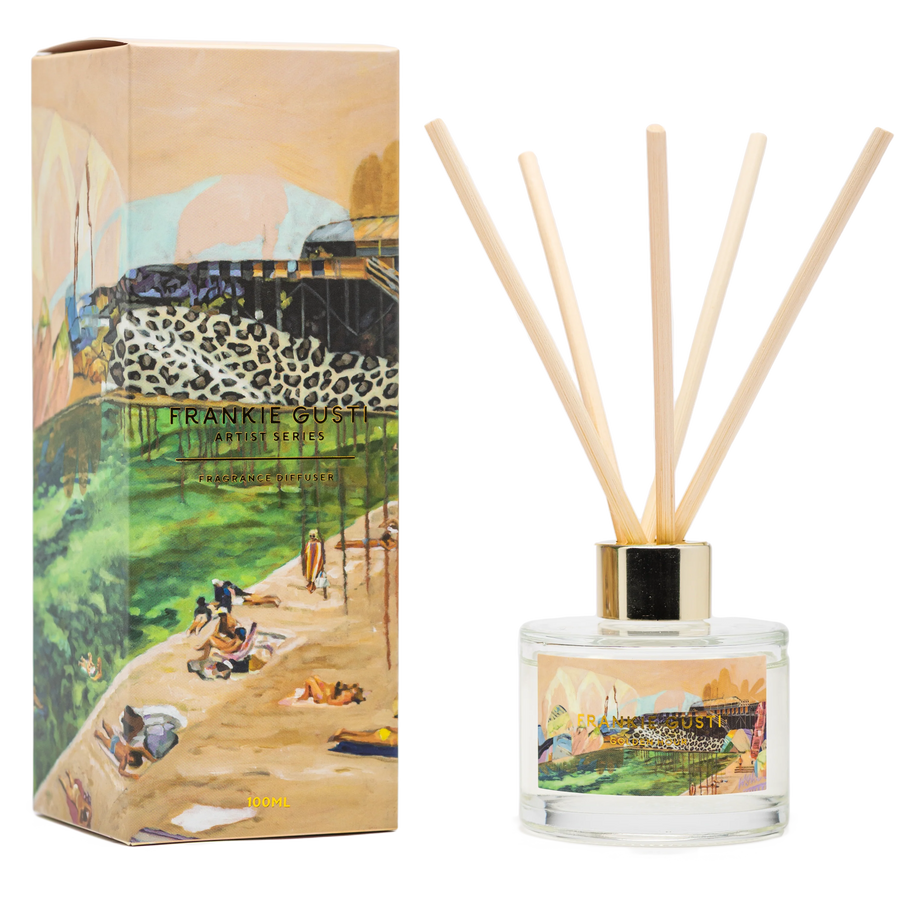 Reed diffuser set with artistic packaging featuring a scenic design.