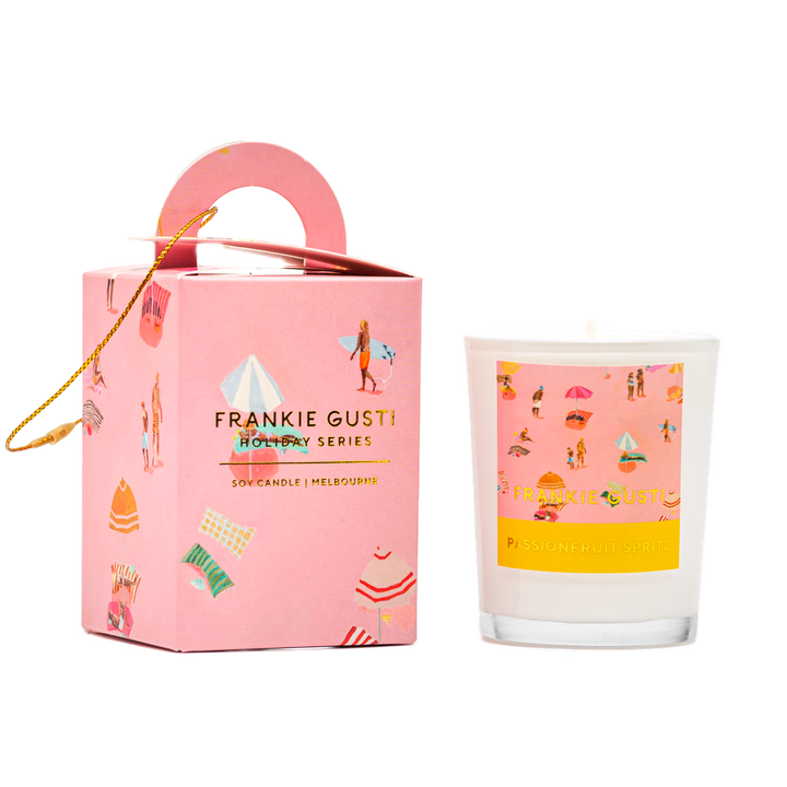 Pink Frankie Gusti candle with decorative packaging on a white background