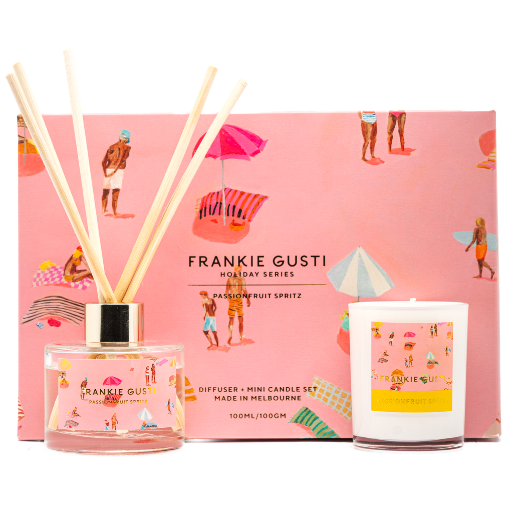 Diffuser and mini candle set by Frankie Gusti with a pink beach-themed box in the background.