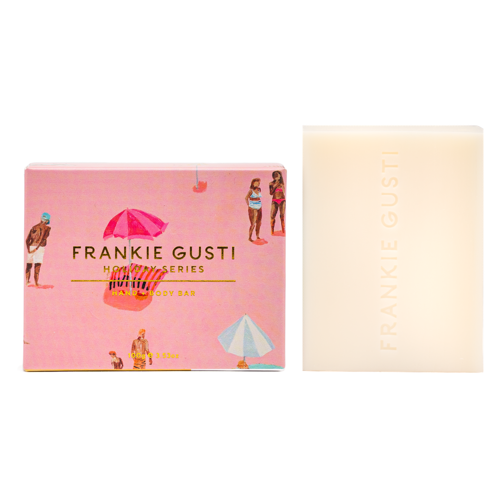 Frankie Gusti soap bar with pink packaging featuring illustrations of people and umbrellas on a white background.