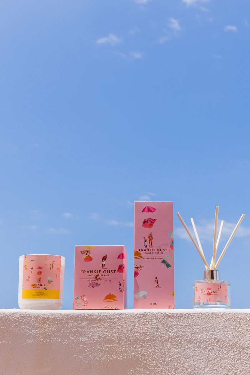 Frankie Gusti candle & Diffuser on a ledge with a clear blue sky