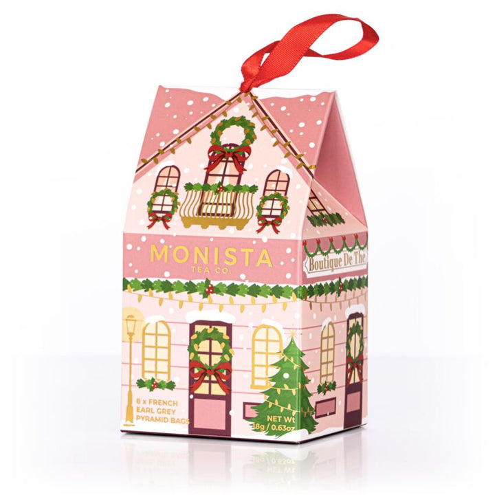 Christmas-themed gift box with 'Monista' branding on a white background