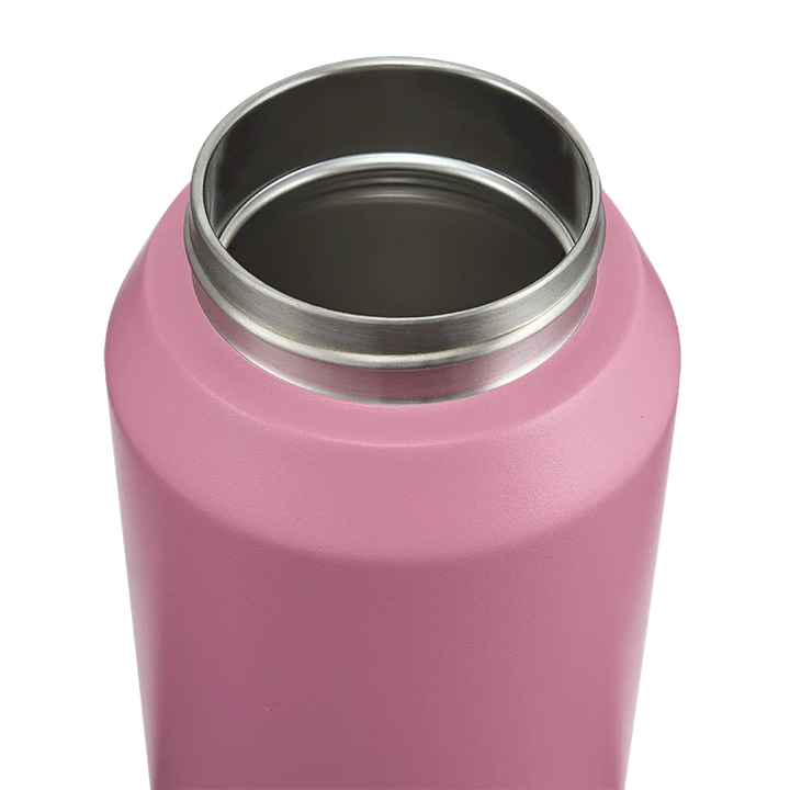 Pink insulated bottle with silver interior on a white background