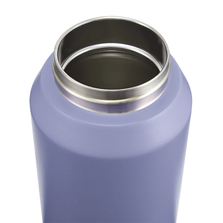 Close-up of a purple insulated bottle with a silver interior on a white background