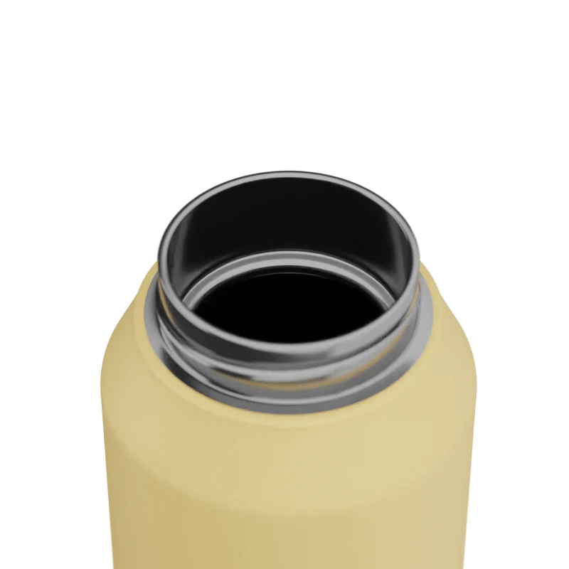 Close-up of a yellow water bottle with a silver interior on a white background