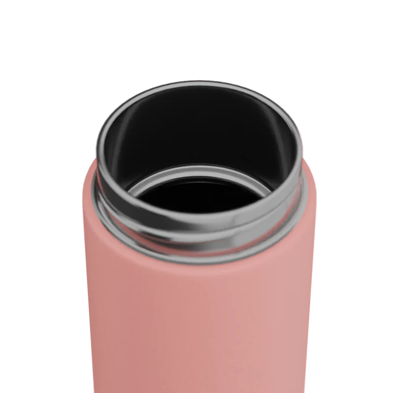 Close-up of a pink drink bottle with a silver rim on a white background