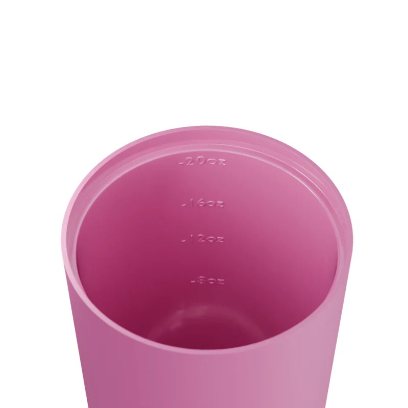 Pink tumbler with volume markings on a white background