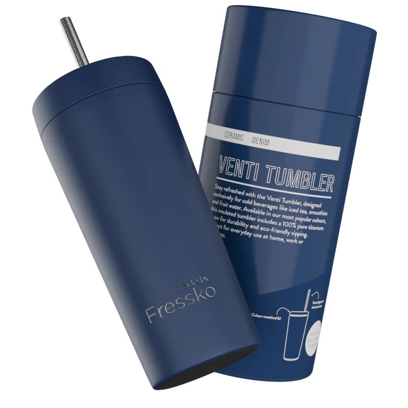 Blue tumbler with a straw on a white background