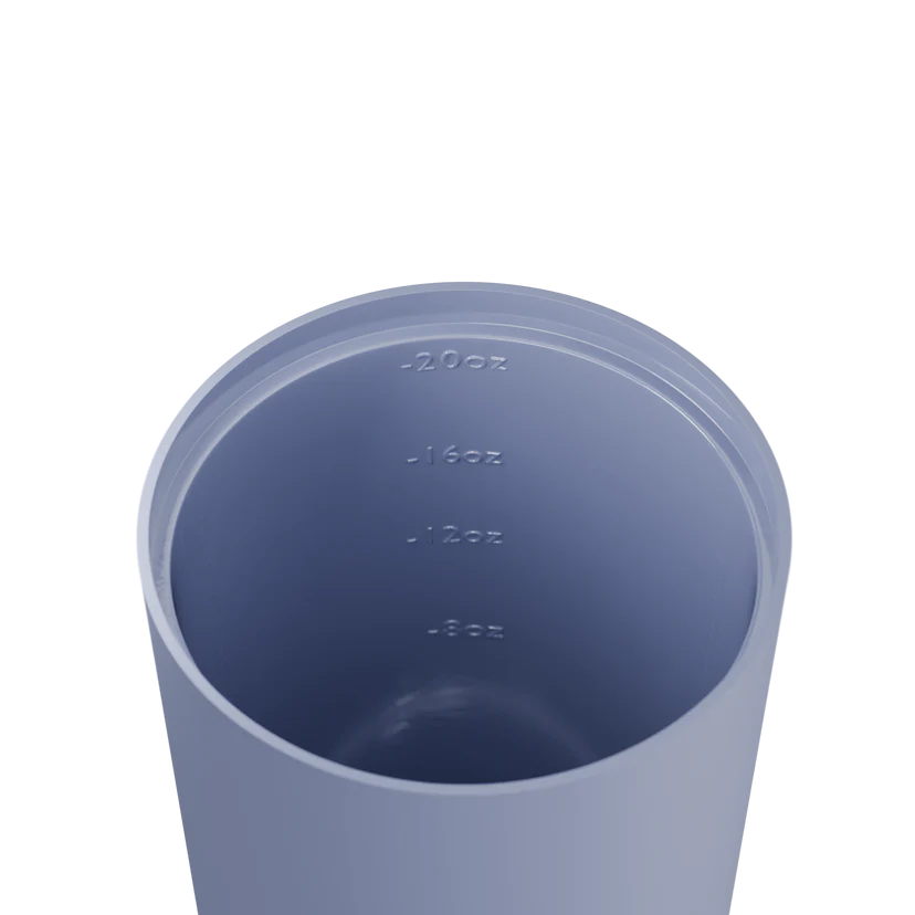 Blue tumbler with measurement markings on a white background