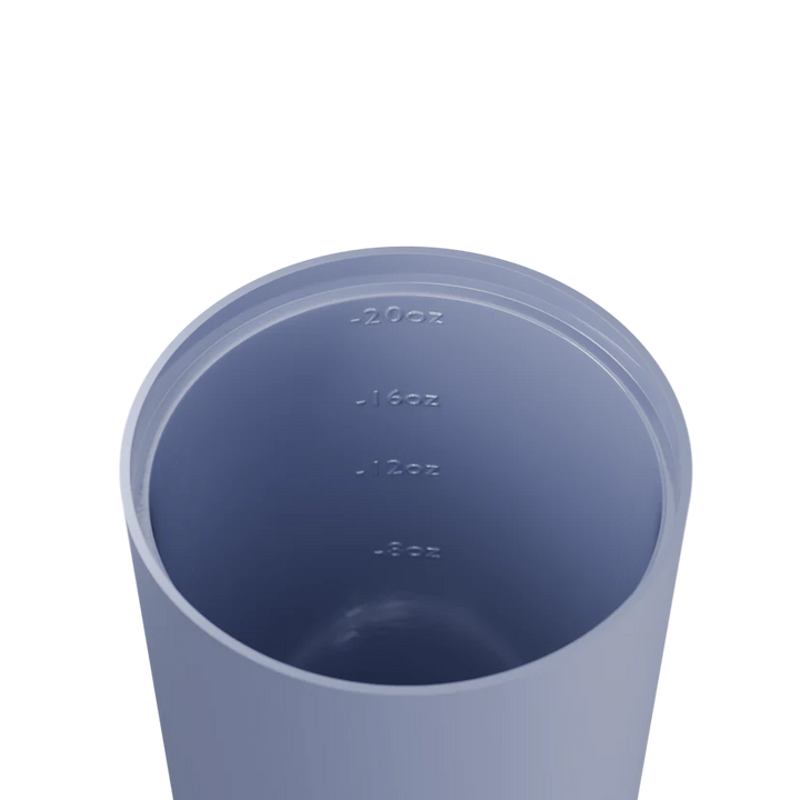 Blue tumbler with measurement markings on a white background