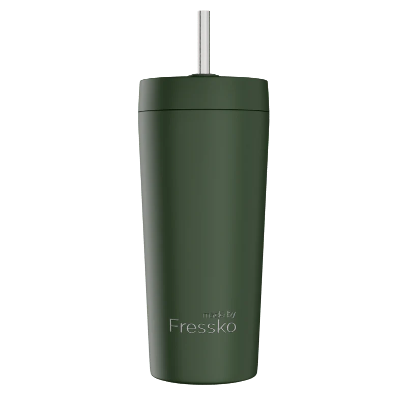 Green tumbler with a straw on a white background