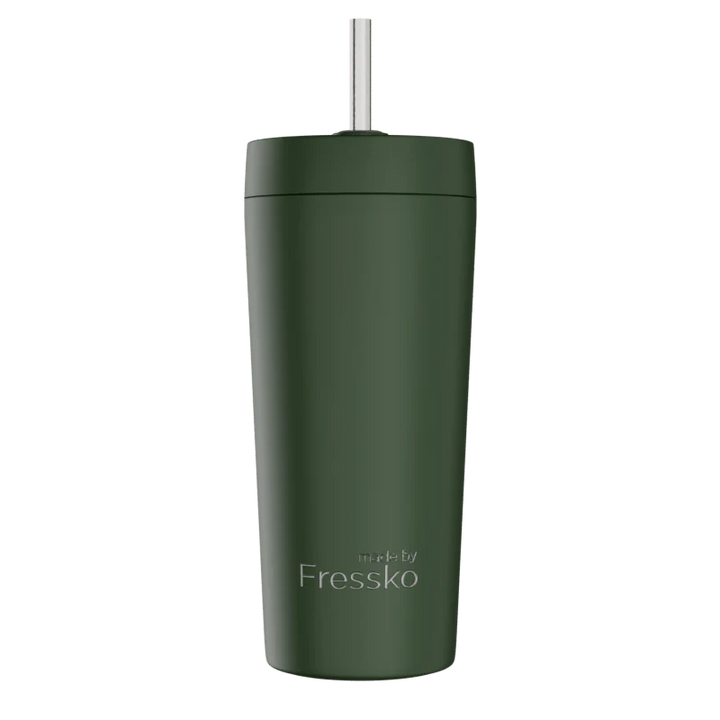 Green tumbler with a straw on a white background