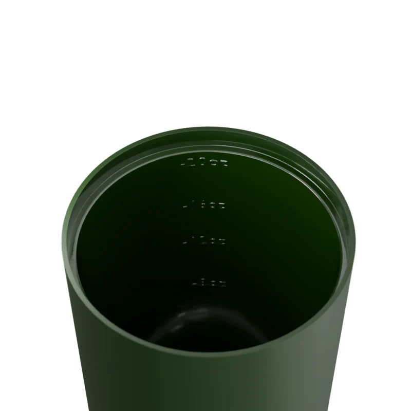 Green tumbler with a lid on a white background