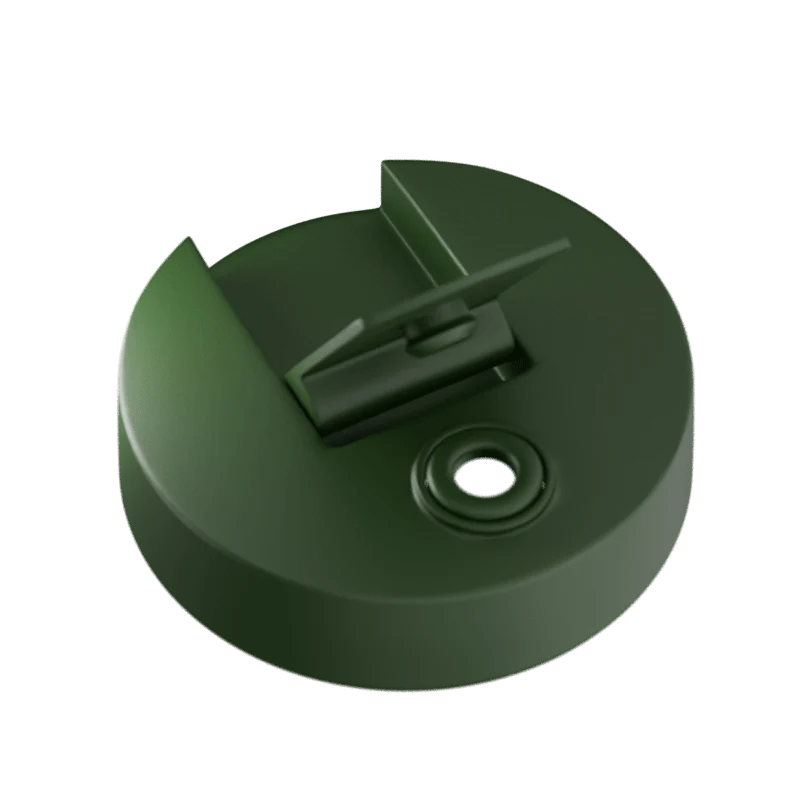 Green plastic cap with a central hole on a white background