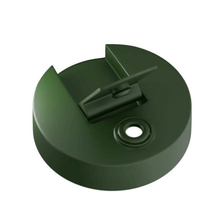 Green plastic cap with a central hole on a white background