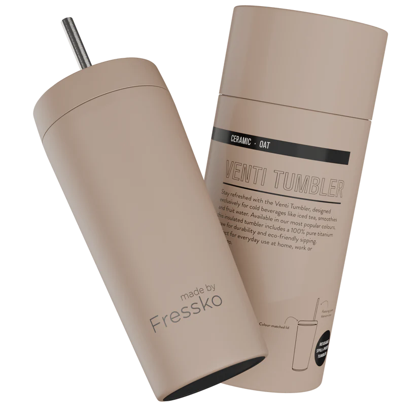 Beige tumbler with straw and packaging on a white background