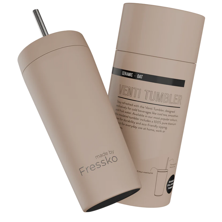 Beige tumbler with straw and packaging on a white background