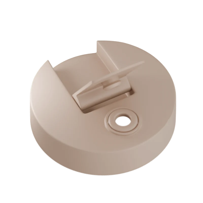Beige plastic component on a white background
