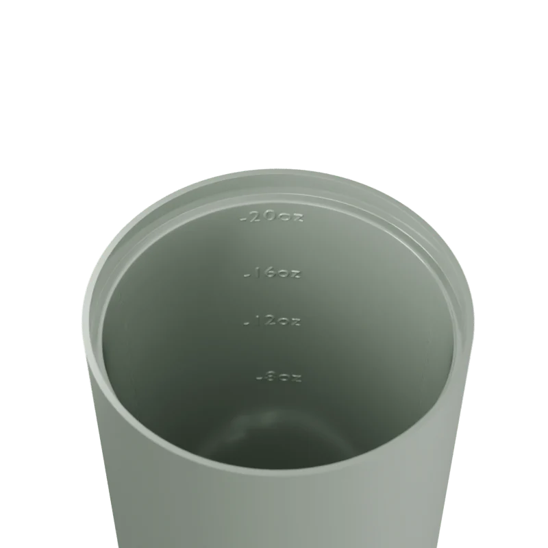 Sage green tumbler with measurement markings on a white background