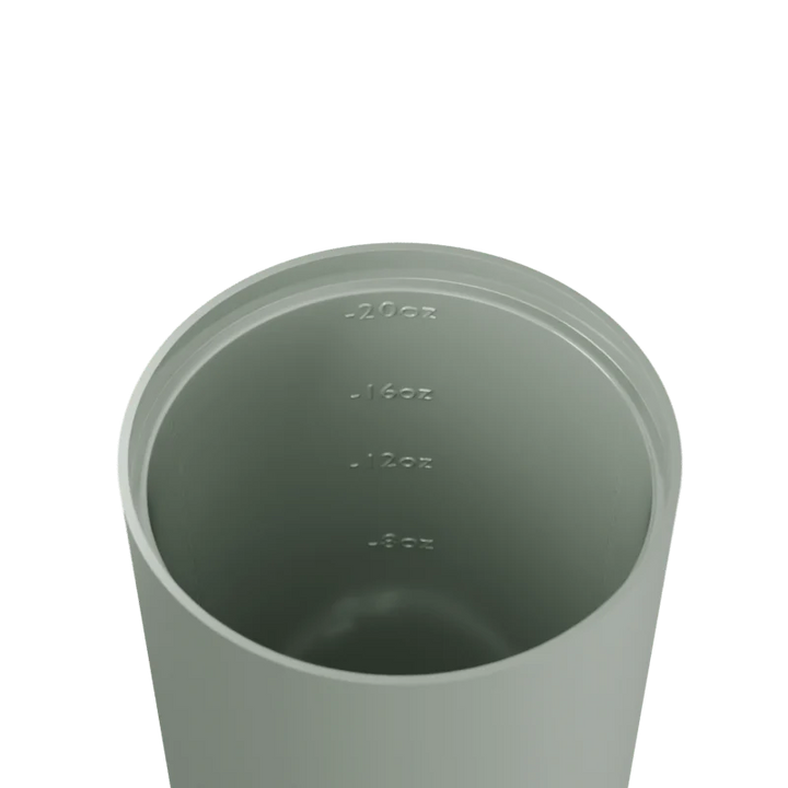 Sage green tumbler with measurement markings on a white background